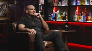 Cain Velasquez seated in a leather armchair during his interview on The Shawn Ryan Show