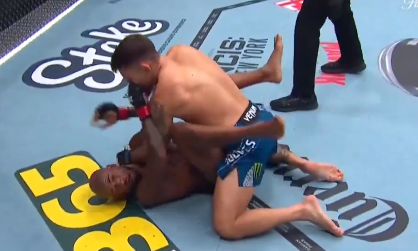 Esteban Ribovics punches King Green during their lightweight bout at UFC 332 in Salt Lake City
