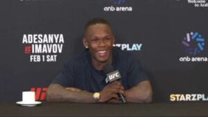 Israel Adesanya speaking with media