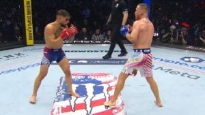 Ilia Topuria and Justin Gaethje square off in the Octagon during their UFC lightweight title fight