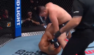 Joel Faglier finishes Javad Mahjoub with ground strikes as referee Marc Goddard steps in at UFC Edmonton