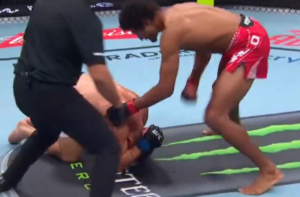 Mandel Nallo lands a punch on a downed Nate Landwehr as the referee steps in to stop the fight at UFC Edmonton