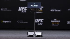 Official weigh-in scale on stage in front of a UFC 333 Abu Dhabi backdrop