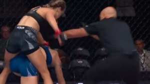 Katlyn Cerminara strikes a downed Mackenzie Stiller as the referee steps in to stop the fight at UFC Edmonton
