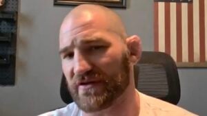 Sean Strickland speaking in a video from his home office